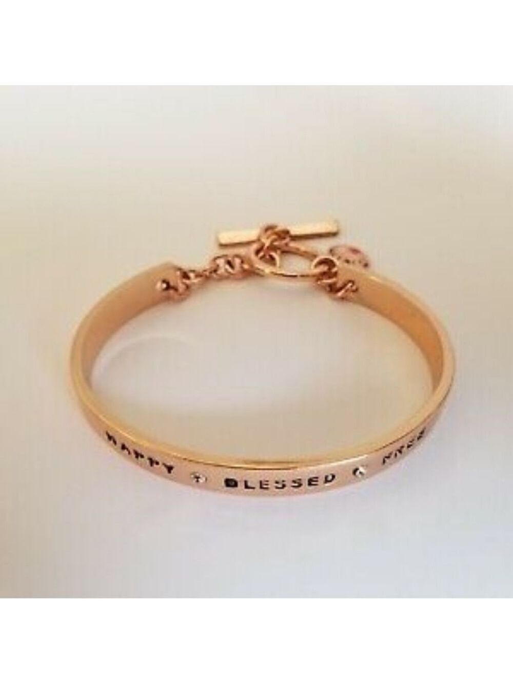 BCBGENERATION ROSE GOLD BRACELET WITH ENGRAVING “HAPPY*BLESSED*FREE”
